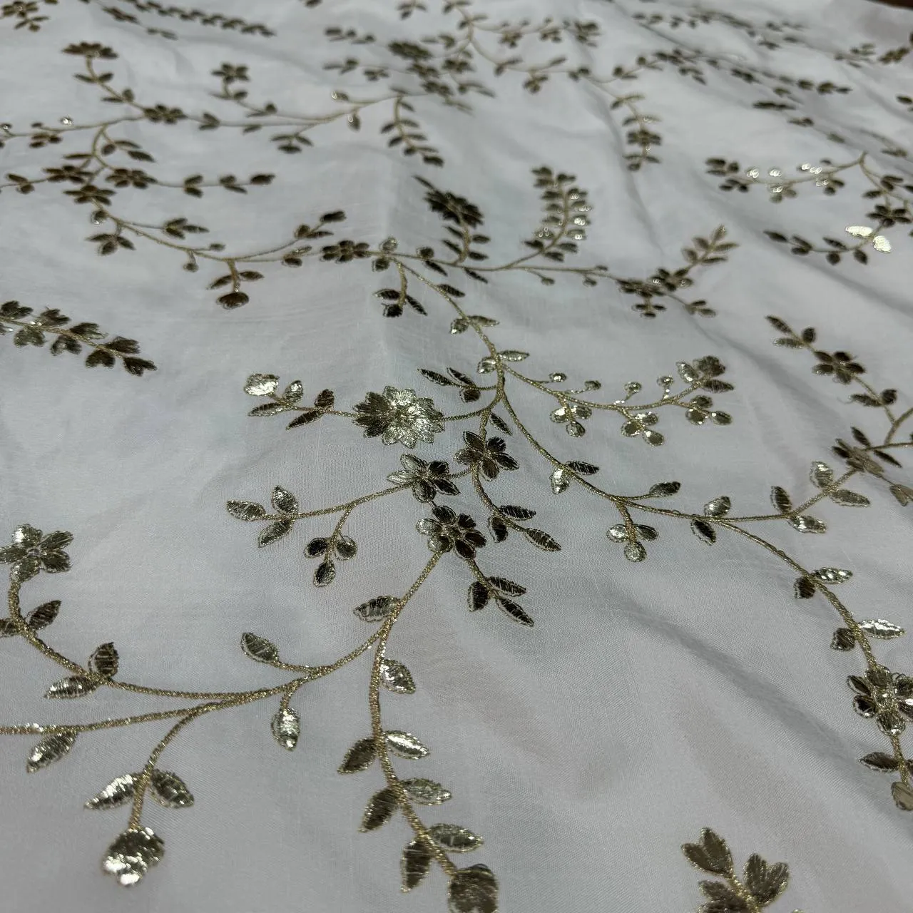 White & Silver Floral Dyeable Zari Foil Embroidered Viscose Dola Silk Fabric (Wholesale)