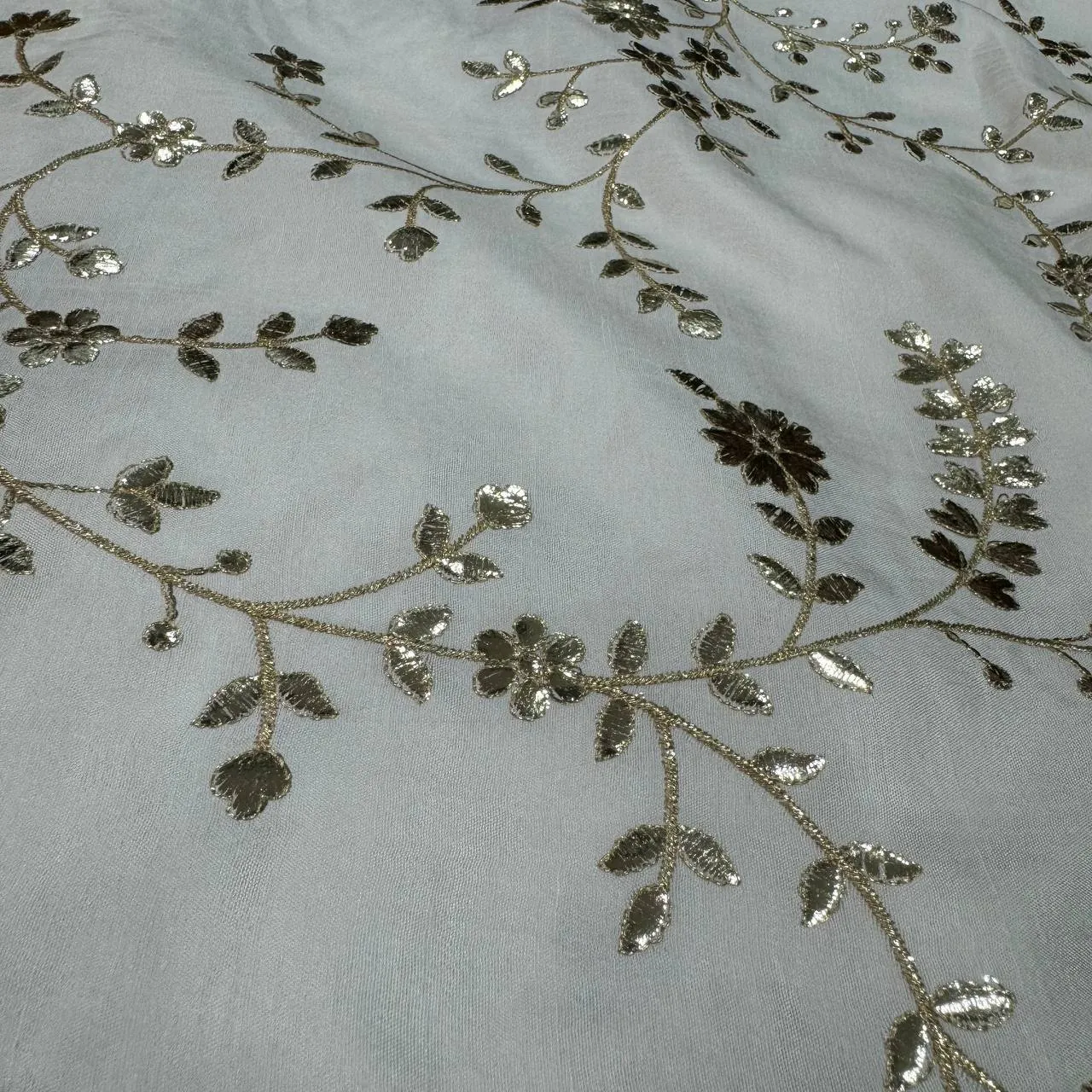 White & Silver Floral Dyeable Zari Foil Embroidered Viscose Dola Silk Fabric (Wholesale)